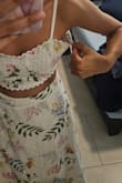 I love this dress. The fabric is 100% cotton. I like all the details, the print and design. It was too big for me, and there was not XXS available so I had to spend extra money on a seamstress to fix it. - Grettel E.