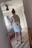 Agree with most reviewers that the material leaves something to be desired. I am usually between a small and a Medium and the Medium did nothing for me - would recommend sizing down. The waist was loose and the back sort of billowed open. I think if you need something simple and cute, this dress is a good solution at a better price than comparable style on Reformation or Anthro. You won't be blown away though. - Sarah Y.