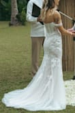 This dress is just GORGEOUS. I fell in love with it the second that I put it on. It has a very slight touch of pink to it that looks wonderful with rose gold and/or gold/pearl jewelry. I'm very petite so I did have to get the bust and waist taken in a bit, but even my seamstress said the dress was of very impressive quality, especially for the price point! I felt like such a fairy princess in this dress at my wedding in Thailand. The dress traveled in my suitcase incredibly well! 10/10 would highly recommend. - Samantha S.
