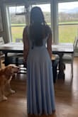 Purchased this dress for my bridesmaids dress in an upcoming wedding. It is the perfect shade of light blue. It does come very long, which is good for the tall girlies who need it, but I took it to get altered and it was an quick and easy fix. Probably took about 3-4 inches off and I am 5'5 to make it floor length with my 1.5 inch heels if that helps! I typically buy a small, but after reading other reviews for bustier girls to size up I got a medium. I am glad I did because there is no give in the bust area, so definitely size up if you are larger up top! The pictures I added are after getting the length altered. - Kylie Y.