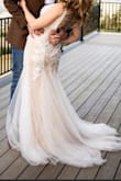 This dress is absolutely stunning! I didn't want to spend thousands on a wedding dress but I didn't want to give up beauty and elegance. This dress checked all of my boxes and then some. I ordered a size small, I'm 5'3 and my measurements are 36-26-36. The bust was forgiving and provided light support but I did end up using inserts for a little more. I also wanted it a little more snug around my hips so I had it taken in. I wore 4" heels and the length was perfect. Overall, this dress is a win. I felt beautiful, my husband loved it and received many compliments from others. I would recommend lulus wedding gowns to anyone looking for a beautiful dress no matter their budget! - Blair B.