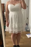 The dress is pretty cute overall, but I agree with the other reviews. It definitely runs small, specifically in the waist. I usually am between a medium and large, but tend to size up anyway because I have a larger bust. The large was still too small (could barely zip it on a good day and completely smushed my chest). I exchanged for an XL, but unfortunately, now it's too big and has a lot of gaping up top. Will probably be returning the XL as well. First photo is the L (only zipped halfway), second photo is the XL. - Jackie C.