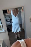 I was looking for a graduation dress that was both comfortable but dressy and cute. This was the perfect find! The material is stretchy, and the midi length is just what I was looking for. The open back is gorgeous too. - Jordan O.