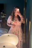 What a lovely dress! I wanted something that I could wear a proper bra with and this dress had that AND  a flare to it with a beautiful pattern so I took a chance and bought about two weeks before my friend's wedding! So glad I took the chance on it. I received several compliments and felt beautiful in it. I bought an XXL after being stuck between purchasing the XL and XXL but figured a little loose is better than a little tight. It fit perfectly and right now I am around a size 14. Recently lost 35lbs and haven't worn anything besides leggings essentially since the birth of my son in 2023 and this dress made me feel like a queen. Highly recommend! - Meagan H.