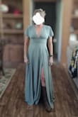 Fits true to size... beautiful color and fabric! Great dress for any age or any occasion (a bridesmaid dress that can actually be worn again). I'm 52 yrs old and was worried it would look too young for me, but I think this dress can be worn at any age. - DEBORAH M.