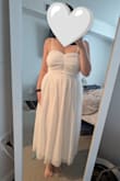 After looking at 4 Lulus dresses, I kept this one for my bridal shower. Not too fancy but not too casual. I sewed a ruching line down the middle to keep the ruffles in place and make the neckline a little more interesting. Very comfortable and moderately flattering. My only complaint is that the seam lines in the bust are quite obvious, it looks like the straps go down to the waist under the tulle - Julia C.