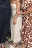 I wore this dress to my bridal shower and it was absolutely stunning! I received so many compliments - the bead and tulle flower designs make the dress so beautiful! The dress runs a little large in the bust and waist area so I had to pull it up frequently throughout the day, but other than that, the fit was amazing - a must have for brides! - Jessica D.