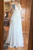 This dress is everything I wanted for my upcoming wedding. Simple, boho, lace. I've tried on other dresses that were more formal, but they just didn't feel like me. I do have a long torso, so that might be why the low cut worked on me. The seam under the bust is tighter than the rest of the dress and I'll need to have the straps taken up (even with my long torso). - Megan B.