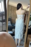 I liked the dress overall, but the plastic pieces of the corset were popping up through the fabric. Didn't include pics of that because I thought pics of the dress on would be more helpful. Really loved the back of this dress, but ultimately returned. - Maria R.