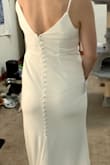 Very pretty and good stretch. The hips were the right size with the waist a bit loose on me, but could be altered. Walking around the under slip felt like it got caught and that was slightly annoying. I ultimately went with a more structured dress. - Beverly M.