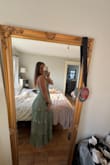 Love this dress. I bought this and one other dress to wear as a guest for a wedding, and this is the one that I was a little unsure of because it's a style that I wouldn't normally pick. But when I tried it on, I LOVED IT. So cute and flowy, and I can't wait to hit the dance floor with it. The fit is also great. I basically have no chest, so I was a little worried it might not stay up super well, but there is a rubbery material at the top that helps keep the dress from slipping. - Siobhan B.