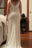 I ordered a few dresses from Lulus. All were excellent quality, but this one was the one I kept. Exactly what I wanted for my big day. Nice and simple yet classy. The train and buttons up the back were perfect details. - ERICA A.