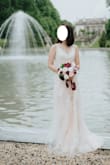 The material is not as comfy, but it looks pretty amazing in the photos. The details and layers made this a nice wedding dress. I specifically loved the open back design. - Claire T.
