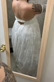It was beautiful! I would wear a medium, but they were out of stock so I figured I'd try a small. Not surprisingly, it was too small and I couldn't zip the back. But the material is great and I love the flowy dress. I'm 5'0, so it was pretty long on me. - Lauren J.