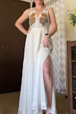 If you're between a S and M, order the S. My waist measures 28.5 inches right now, but this dress is LOOSE. The M waistband is 16 in across, so 32 all the way around. In the bust it's alright (sticky bra), I'm 32D (almost DD). I'll need to take this in at the waist or exchange for a S. Overall, the dress itself is really pretty, the fabric feels nice and light, but not see through. Lined nicely. - Sarah O.