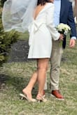 Perfect dress for a courthouse wedding. Simple and elegant. I love the bow detail at the back! But it runs a little large and the sleeves are too long. I had to alter it with a tailor. - Johanna O.