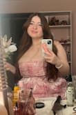 The dress is a little little shiny but looks so beautiful. It is a little long for me but wasn't that big of an issue without or with heels! It fit very comfortably and the corset keeps the girls in place!! Got so many compliments at Prom as well and highly recommend this dress - Lupita O.