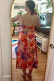 I love this colorful dress! I ordered my normal size medium and it fits me well. The open back is also perfect AND still covers up a normal strapless bra! Fabric is very lightweight and flowy and the dress is fully lined. - Summer V.