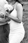 It was a very fitting and stretchy dress which personally I loved. It ending up raining on our wedding and was pretty muddy. Luckily, for it being such an affordable dress, I really didn't mind. I was just happy to be there!! 10/10 - Sierra F.