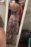 I love the high low look and how pretty this flows when you walk. The material is soft and airy. I have to wear a strapless bra with it because there is no support but that's okay. I like that I can adjust the straps so that it fits my body better. There are little gold threads throughout that shine and look pretty. I tried both a small and medium and stuck with the medium. The small was just a tad tight around my rib cage. - Jordan L.
