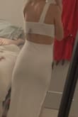 I really love this dress! The material is super soft and it is double lined which is always nice when wearing white. It is really comfortable and flattering! - Pietra S.
