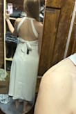 I wanted to love this dress, but the top was less structured than I expected. The fabric was thin so I couldn't go braless, and the low back left silicone cups as the only option. The bow in the back was also thick and hard to lay in a flattering way. - Megan K.