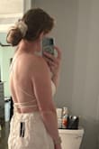 This dress is adorable and I'm excited to wear it for my bridal shower. I didn't give 5 stars for 2 reasons. 1) The left side on the chest seems like it was sewn a little crooked or something; it doesn't quite lay as nice as the other side. You can sort of see it in the photo by my arm. I probably could've exchanged for a new dress but didn't feel like it was worth the hassle. 2) I wish the spaghetti straps were a little higher quality; it's a little difficult to get it tied to my liking. I have CAKES nipple covers on in this photo. The material is thin so you'll probably want a little something on underneath. However, as a tall girl, I'm happy with the length. - Kaitlin K.