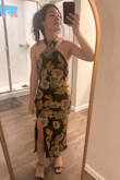 I read the reviews and sized down, I usually wear a small. This dress fits me like a glove and makes my athletic, built body look like an hourglass shape, and I can't with the excitement. Love the color of the flowers that are like a rusty gold. The feel of the fabric is super nice. I'll wear without a bra size I have very small breasts. I think that you can dress it up or down with different shoe styles. The low back makes it super sexy but it's definitely not too much.
I'm super happy with my purchase. - Dora C.