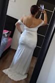 The cut of this dress is very flattering for curvy women. The cut is body-hugging, but it's a beautiful wedding dress. - Alejandra M.