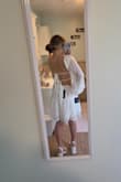 Bought this for my bridal shower and absolutely love it! Exactly the vibe I was going for! Due to the low back, the sleeves do tend to fall, but I just got a double sided tape and they don't budge using that! - Ally G.