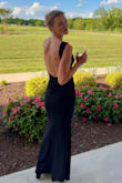 Fits true to size, love the open back. Worked well just with sticky bra cups. - Amy O.