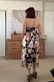 This dress fits true to size IM0- beautiful and flowy. Love the tie at the back, I'm big on bows. The front of the dress wasn't very supportive, so my chest was kind of squished down, but I didn't mind because of how beautiful this dress was! Can't wait to wear it again..bought it for my 40th :) - Rachel D.
