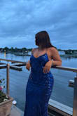 I wore this to my junior prom and fell in love with it! The dress fit perfectly all the way around. I'm 5'2, and with heels, it was the perfect length, and for the bust area, it fit perfectly with a sticky bra even with my small boobs. The abdomen area didn't accentuate my belly, so I didn't need to wear shapewear or anything (so so nice). I especially LOVED the little train on this dress as it gave it an extra flair and made it stand out from the hundreds of blue sequined dresses I saw at prom. The stringed up back looked amazing, and I recommend an updo for the hair to show it off. Overall beautiful and I'll definitely be wearing it again! - Maria P.
