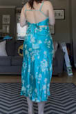 The color is exactly the same in person, and the fit is perfect! I have a hard time finding dresses that aren't too low cut but also cute at the same time! I have a small chest, though, so this may be a bit more revealing if you have a bigger chest. I got a large based on the size chart, and it was perfect. I'm typically a size 8. - Jesse G.