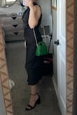 Like other reviews say, the asymmetrical design is way more obvious in person and is a bit off. It doesn't look quite right. I'd say it runs true to size but if you have any sort of pooch, you'll want some GOOD shape wear. This dress doesn't have any give so it's hard to get on and off. The material feels nice. - Mary H.
