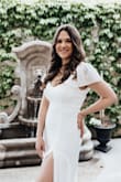 The dress was beautiful and the material was light and classy. I loved the slit for the leg. It fit nice around my waste and I liked the open back. - Jocelyn C.