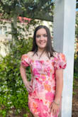 The fabric is lovely and the dress is very well-made. Sleeves can be worn on or off the shoulders. My daughter loved the dress and got many compliments on it all evening. - Monica T.