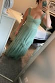 Even more pretty in person! Like tulle with shimmer on it. I had a baby 6 months ago and it feels very comfortable and flattering at the same time. - Tiana G.