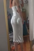 I love this dress and can't wait to wear it IRL! I will say, as a small chested gal, the top part was a bit loose, as were the straps, but the rest of the dress accentuated my figure PERFECTLY. I bought this dress as a back up for my wedding reception as I'm currently having a few issues with my actual wedding dress, but now, even if my issue is sorted, I might change into this dress at some point in the night just because! One thing to note, however, although not a deal breaker for me, the zipper was a bit tough. It felt like every time I'd try and zip it up, it would get caught on sequins. - Kat G.