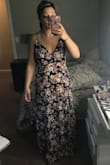 This dress is perfect for a summer event. The v in the front isn't low, so you can wear it to family events. I'm going to wear it to a graduation event. I had first got a small, but It was very firm fitting and the top was too small for my breasts. The medium had more give in the waist and fits my cheats perfectly. I have curves and it also hits all the imperfections. - Laura W.