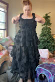 I think this dress is really pretty, but just didn't quite work out for me. The waist and hips fit me perfectly, but the bust and straps were too big. If I had more time before I had to wear it, I would totally keep it and just have it altered because it is very pretty and unique and feels like good quality. Some of the reviews of this dress in white talk about it being see-through, that's definitely not a problem in the black color. It was also kinda long on me! Not quite floor length, but I would consider it a little longer than midi/tea length, it landed right above my ankles. For reference, I ordered a size XL, I am 5'5, 200lbs, bust 36", waist 34", hips 48". - Ailsa B.