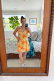 This dress is a fun color, and the fabric is a cotton/linen feel. The top in a size small was very roomy and puckered at the top. I sent the small back and ordered the XS. Have not gotten it yet. - Lisa C.