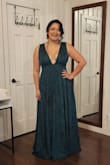 At 5'10, I didn't trust it would be long enough for heels, but I should have! I'm in flats in these photos. The underbust has NO give or stretch so size accordingly. I might've been more comfortable in an XXL instead. It desperately needs pockets. The zipper DOES feel a bit weak, and I was a little nervous that one wrong move would bust open the back, but it held up all day. - Christine V.