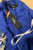 Bought this last year for my partner to wear; she ended up choosing another dress for that event. Fast forward to this year and we took it out to try on for our bridal shower- it still has the tags on and the zipper broke. I am done with Lulus, it is all cheap material for an expensive price. - Samantha M.