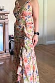 Love love love this dress! As a very petite female, it's very hard to find dresses (especially long ones) that fits and flatters. This one is gorgeous and flattering. From reviews worried about the fit being too small but XS fits perfect (maybe a bit snug but breathable). Did not think the ruffles weighed me down at all and it's just so fun and pretty. - Stephanie T.