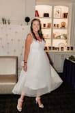 I absolutely adored this dress and felt so beautiful in it! I did have to get the straps altered to make them shorter. This helped because I am busty and wanted minimal cleavage. The seamstress also suggested hemming the white underlay and I would highly recommend that. I loved the look! - Ellen T.