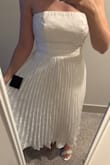 I ordered this dress for my rehearsal dinner as the bride. I am typically a small in everything at Lulus, but this dress is extremely tight and unforgiving in the bust and rib cage area. I kept the small because it ultimately fit me, but is super tight. I decided to just deal with it since I don't have time to reorder. Consider sizing up! - Emma L.