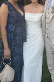 I wore this dress as a wedding guest and absolutely loved it! The color is beautiful, and the fit is very forgiving. It's also super comfortable, flowy, and pretty. I received so many compliments throughout the night.
As others have mentioned, the deep neckline is quite revealing, but it's definitely manageable with some fashion tape.
For anyone deciding between sizes, I ordered both the medium and the large. The difference in overall fit was minimal. I'm 5'7" and 180 lbs, and while the medium felt a bit snug, it was still very wearable. I could have pulled it off if that was the only size I had.
My only complaint is about the white hanging straps on the inside of the dress. They kept slipping out and ended up showing in a lot of my photos. The contrast against the dark fabric was really noticeable and distracting, which took away from the overall look.
Other than that, it's a lovely dress that I'd definitely recommend! - Gen B.