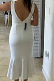 This dress fits beautifully, is so well done. The fabric is gorgeous, and it looks expensive. I love how the fabric flows and how it's shaped. I love the lower back and the whole fit. - Monica P.