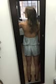 I listened to the reviews and ordered a size up (usually a small, ordered a medium) and I should've stayed true to size. I thought about re-ordering but decided against it because of the neckline and the material. Since it's backless you can't wear a bra and the material is too thin for me to be comfortable going bra-less. Also, the neckline on the model is more rounded but is straight in person. I tried tying it at multiple lengths but the neckline stayed straight across no matter what. Overall it's a cute romper, it just isn't for me. - Kelsey S.